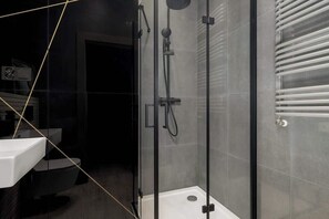 Comfortable bathroom with shower.