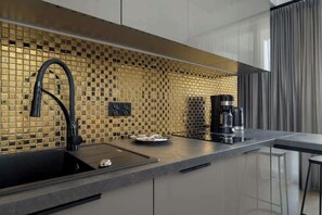 Kitchenette with coffe machine.