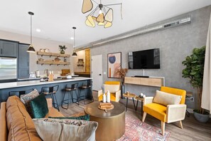 elax in the open-concept living room and kitchen, perfect for gathering with loved ones and enjoying quality time together.