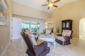 Cozy Gathering Space - - Kick back in a charming seating area with wicker chairs and floral cushions
- A perfect spot for conversations, morning coffee, or a relaxing afternoon
- High ceilings and open views add a sense of warmth and elegance to the space