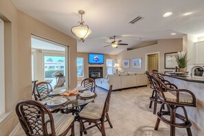 Dining & Living Connection - - Bright and airy dining space with a view of the living room’s cozy fireplace
- Perfect for family meals or entertaining guests in a connected, open layout
- Enjoy seamless flow between dining, lounging, and outdoor access