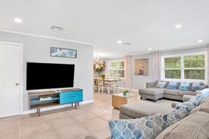 Beautiful open concept living room with plenty of seating for the entire family!