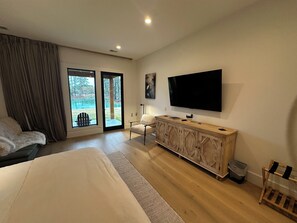 Smart tv, reading chair, luggage rack, dresser with shelves for all your things 