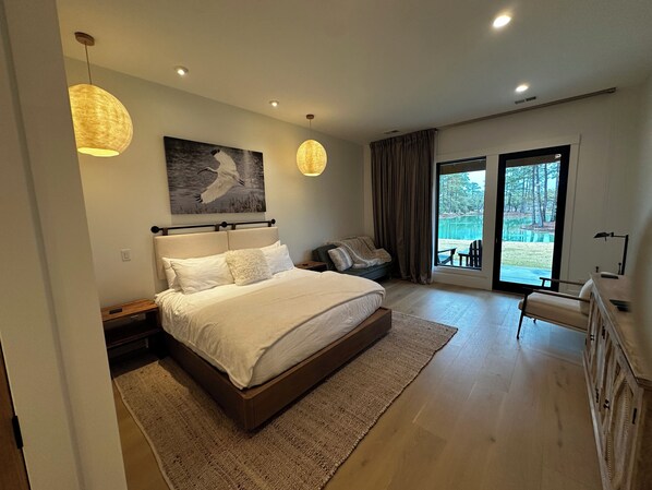 Luxurious bedding with king bed and twin futon.