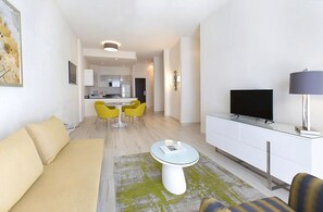 Living room and dining area. Exact unit will be assigned upon arrival. Views, colors and decor may vary.