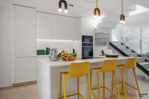Fully equipped open plan kitchen.