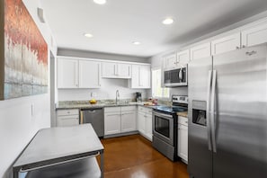 Spacious kitchen with stainless steel appliances and plenty of counter space.