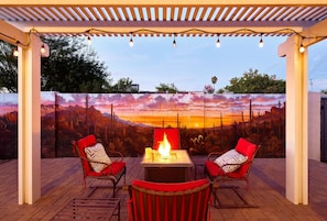 Private backyard patio with a new mural, outdoor dining area, ample seating, hot tub, above-ground pool, lounge chairs, fire pit, BBQ grill, ping pong table, and horseshoe.