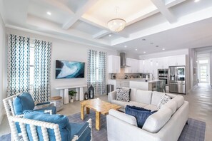 Welcome to Seaside Sanctuary! This spacious home sleeps up to 12 guests. Enjoy beach days, relax by the private heated pool, and make unforgettable memories! | Seaside Sanctuary, Naples, Florida | Voyax Luxury Vacation Rentals