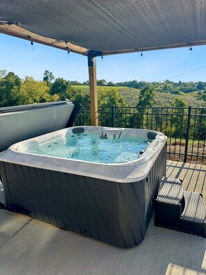 Relax in the outdoor hot tub with expansive long-range views, just steps away from the pool. The ultimate spot for unwinding and soaking in both the bubbles and the scenery!