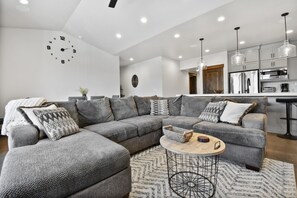 Inviting living room with a cozy sofa and a beautiful view of the mountains.