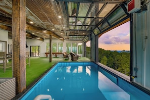 Large garage-door windows open for incredible views.