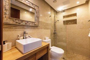 Luxury bathroom with plush towels, hair dryer, and premium shampoo, conditioner, and body wash for your comfort.