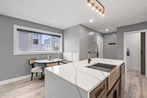 There is a dining table just off the kitchen for all of your group meals