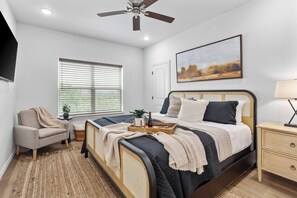 Retreat to the master bedroom, a spacious sanctuary with a luxurious king-sized bed, soft linens, and a private ensuite, offering ultimate comfort and relaxation.