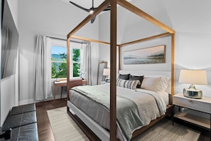 Upper primary bedroom with luxury bed and en-suite bathroom.