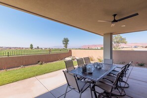Back Patio Dining Area - With plenty, of outdoor seating you are sure to enjoy grilling your favorite dish on the BBQ and dinner under the stars on this beautiful back patio area.