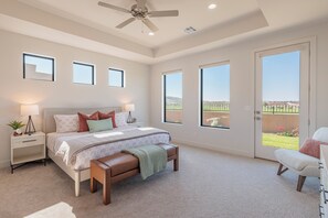 Main Bedroom - The main bedroom is furnished with a plush King bed, private TV, and walk-in closet.