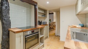 The charming kitchen is full of character
