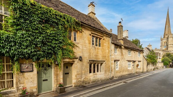 Spinner's Cottage sits alongside St John's Church