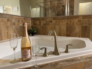 Let your stress melt away as you soak in the luxurious, large jetted spa tub. 