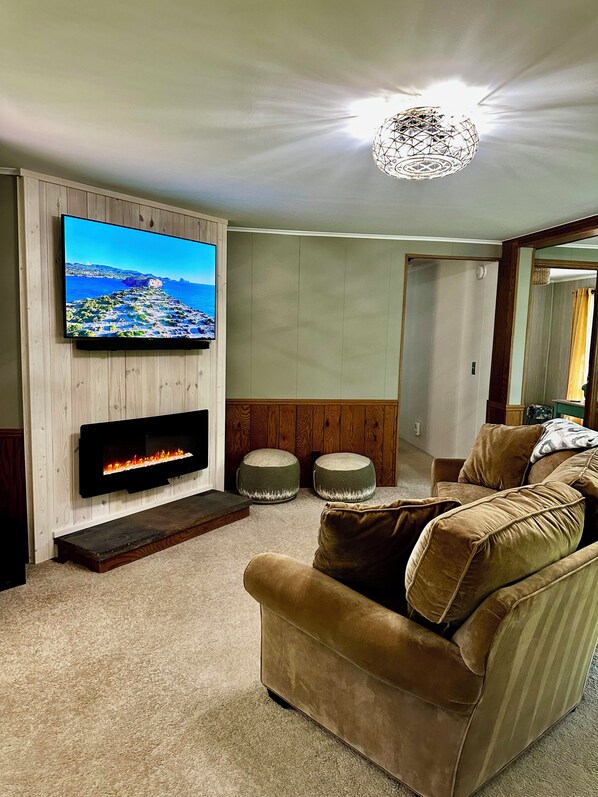 Enjoy the ambiance of the electric fireplace and smart tv.