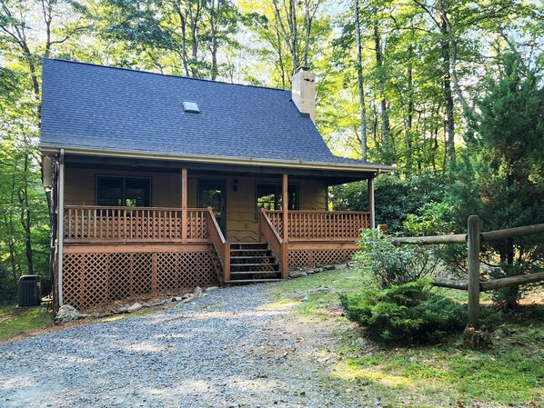 The Shady Chalet with its large front porch and yard ready for your memories