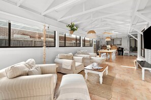 The lounge area is equipped with a Smart TV and comfortable couches to sit back and unwind