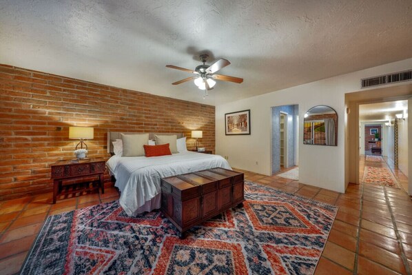 Spacious and bright primary bedroom with king bed and en-suite bathroom