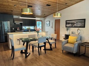 Kitchen and dining area, open to the living area. 
