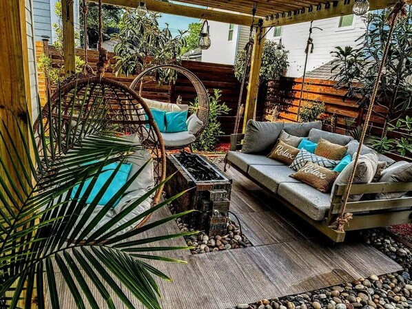 Outdoor Day bed, egg chairs, and firepit