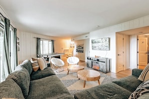 Downstairs Living space with ping pong table, large TV and oversized couch!