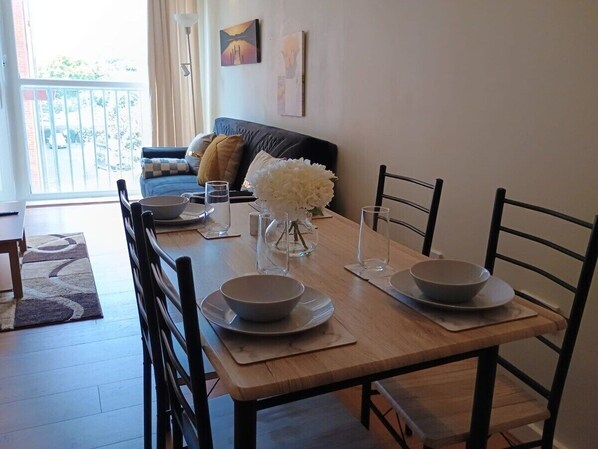 Gather in our elegant dining room, designed for comfort and style. It features a spacious dining table, perfect for enjoying meals with family and friends, and creating memorable dining experiences during your stay.