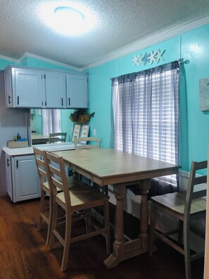 Seating for 6 with bar and island area.  