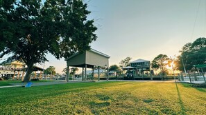 Large outdoor pavilion for gatherings, surrounded by nature.