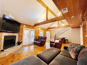 Spacious lounge with vaulted ceilings and rustic charm.