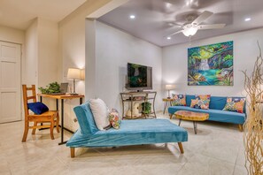 The living area enjoys a fold out sofa and lounger.