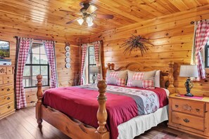 The main-level king suite boasts a private ensuite, Jacuzzi tub, & Smart TV