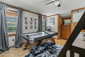 Bedroom 3 with twin/full bunk bed, and air hockey table