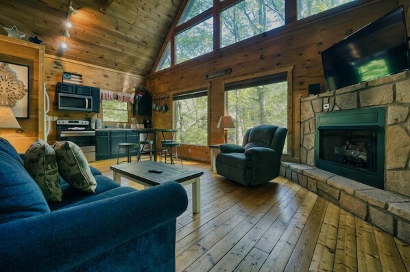 Curl up in the airy living room & stream your favorites by the fireplace