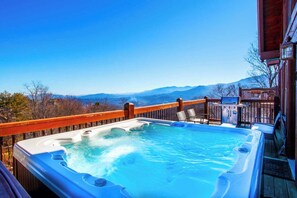 Soak all your cares away with stunning views on the back deck