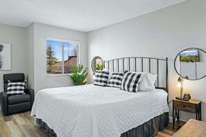 The welcoming king suite includes a private ensuite & cozy lounge chair
