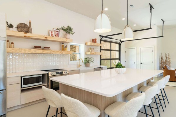 Enjoy mealtimes together at the spacious kitchen island, seating 6