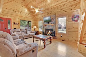 Curl up in the living room & enjoy a movie by the seasonally-available fireplace