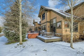 Private patio with hot tub, BBQ, and patio seating for 4