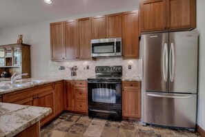 Kitchen with drip coffee maker, toaster, slow cooker, blender and more