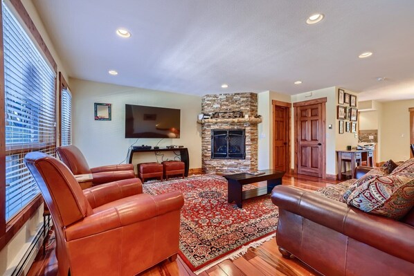 Living room with TV, and gas fireplace