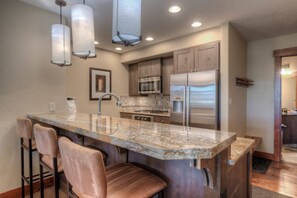 Kitchen with drip coffee maker, toaster, blender, slow cooker, and more
