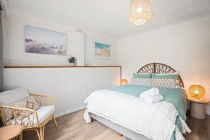 Comfortable Queen-Sized Bed in separate bedroom with luxurious quality linen.