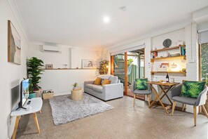 Spacious open living for kitchen, dining and lounge area. Double Sofa Bed